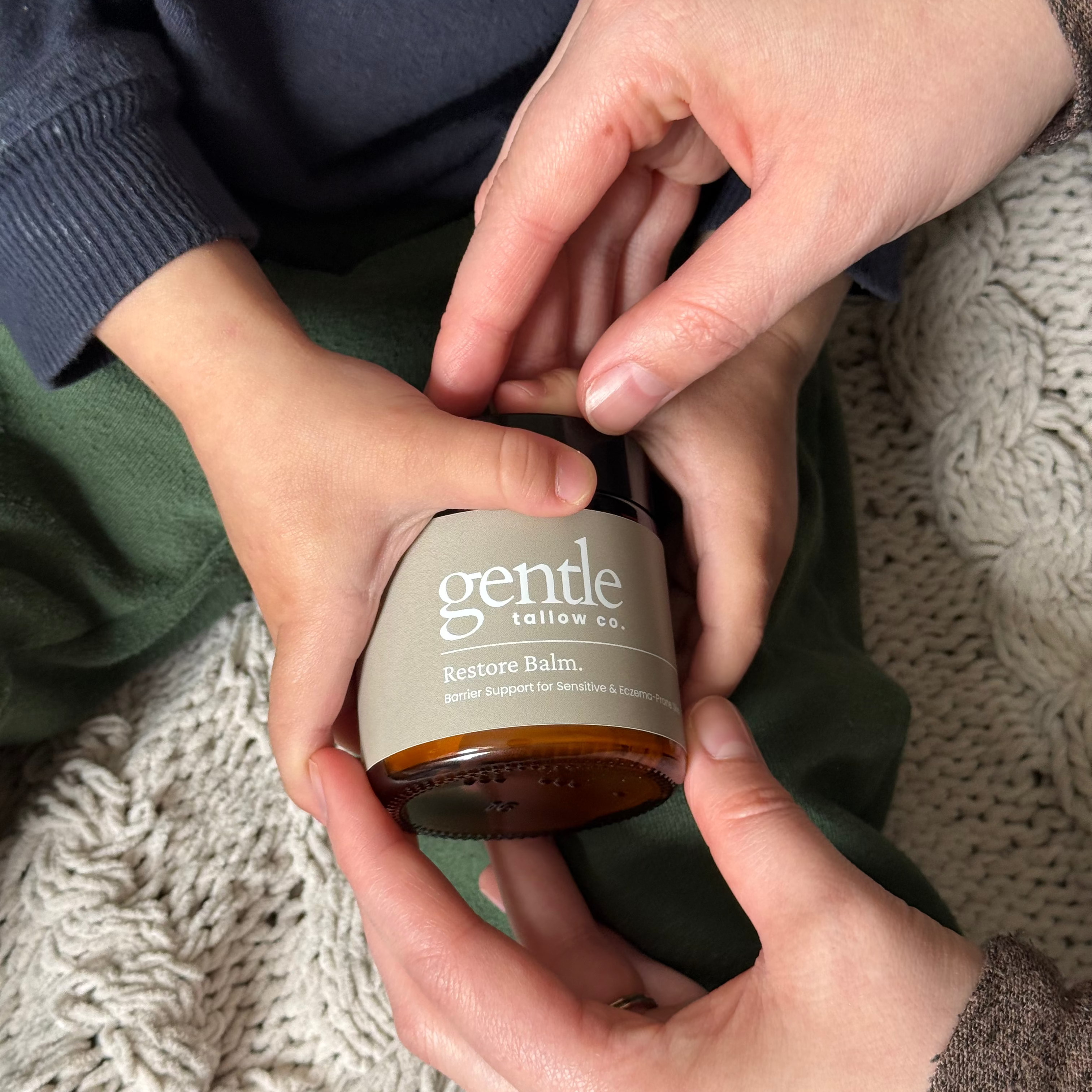 Mom and baby holding Gentle Tallow Co. tallow balm for eczema-prone skin